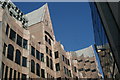 View of the London Underwriting Centre building reflected in the windows above EAT on Mark Lane #2