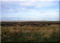 ND1748 : Wind farm and peat extraction from A9 by Alex McGregor