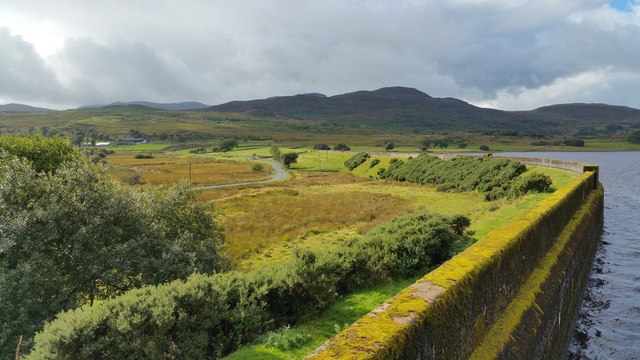Dam wall at the southern end of Llyn Trawsfynydd and the northern Rhinogydd
