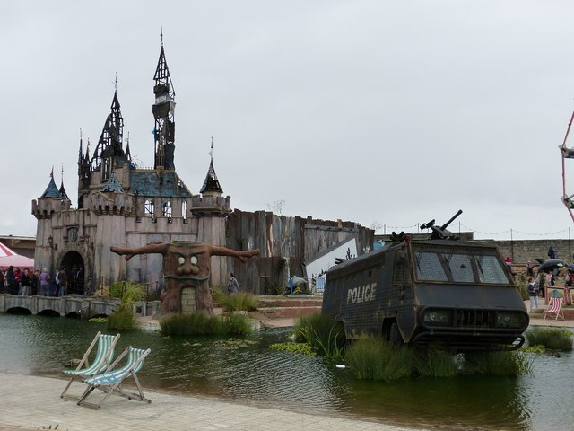 Dismaland - Dismal Castle and Police vehicle (stranded)