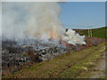 SK2187 : Controlled heather burn on Derwent Moor by Graham Hogg