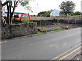 Doosan excavator in a fenced-off area of  Llanover Road, Blaenavon