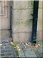 Bench mark on the old Gas Showroom, Bridge Place