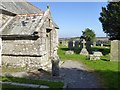 Celtic cross outside porch of Mabe church and the churchyard