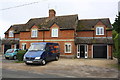 Bradley Cottages on NE side of the B4017