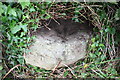 Benchmark on stone in field beside Cowling Lane