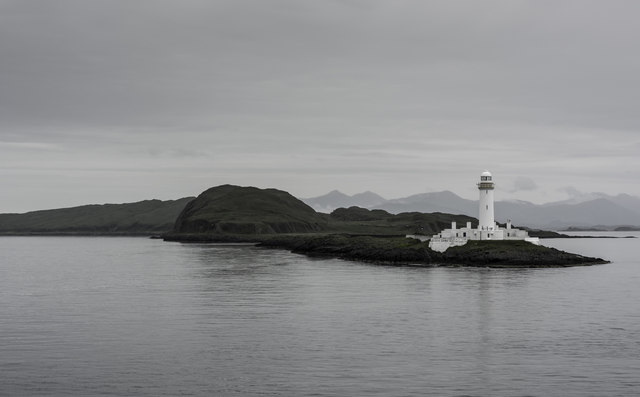 Eilean Musdile Lighthouse viewed from the Barra to Oban Ferry