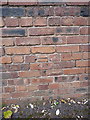 OS benchmark - Leegomery, wall beside Grainger Drive