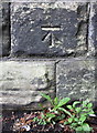 Benchmark on railway bridge abutment, Burley Road