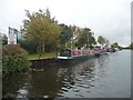 Slow down past moored boats, Selby Canal