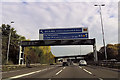 Motorway signage and minor road bridge east of junction 19