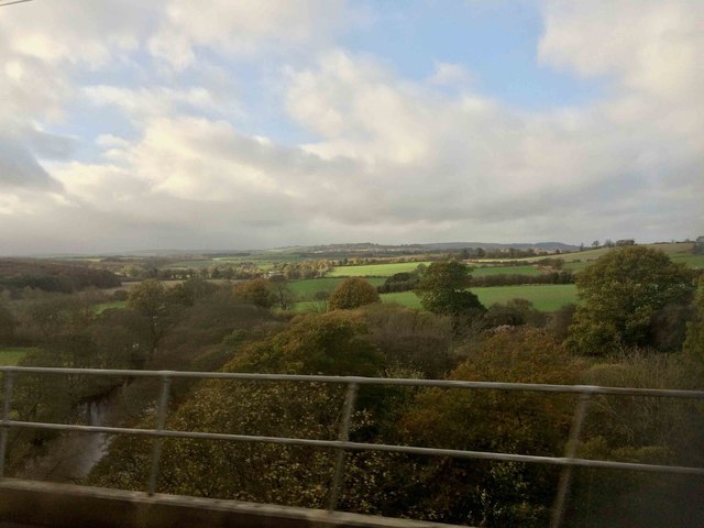 View over the River Aln from an East Coast train heading South