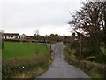 Vehicles heading out of Crossgar along the Derryboye Road