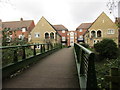 Footbridge over the Abbey Stream and housing