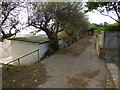 Path between beach chalets and back gardens