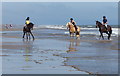 TF5575 : Horse riders on the beach at Wolla Bank by Mat Fascione