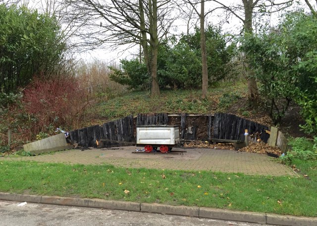Audley: vandalised seats with coal tub near Community Centre