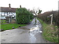 Road becomes bridleway at Barnsfold Farm House