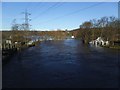 SE2535 : River Aire in flood at Kirkstall Bridge (2) by Stephen Craven