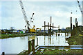 Driving piles for bridge over River Can, 1990