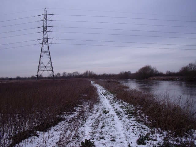 Snowy footpath and pylon by the River Trent