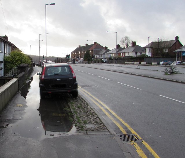 Large puddle on a Malpas Road pavement, Newport
