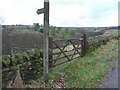 Gate and signpost on Sowerby Bridge FP127