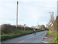 Cyclists heading west on Wand Lane, at Gallows Hill