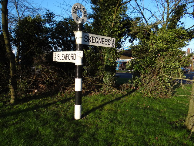 Old signpost in a roundabout