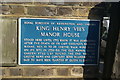 A blue plaque showing the site of King Henry VIII