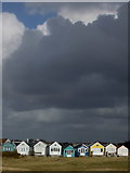 SZ1891 : Mudeford: beach huts under a threatening sky by Chris Downer