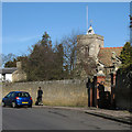 Fulbourn: jogger, church tower and manor-house gates