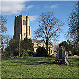 TL5686 : Littleport: parish church and war memorial by John Sutton