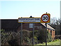 TG2503 : Framingham Earl Village Name sign by Geographer