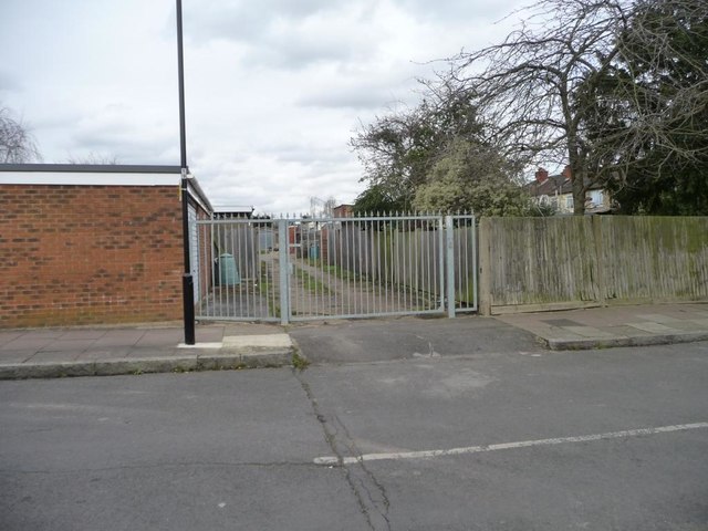 Gated back lane running north from Capthorne Avenue