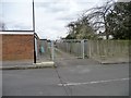 Gated back lane running north from Capthorne Avenue