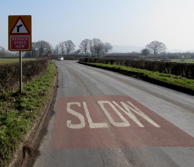 reduce-speed-now-sign-alongside-the-jaggery-cc-by-sa-2-0