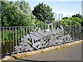 Sculptured railings beside the River Caldew