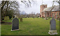 NY6623 : Graves at Church of St Margaret and St James by Trevor Littlewood