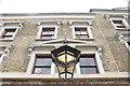 TQ3480 : Looking up at the large lamp above the entrance of Wilton's Music Hall by Robert Lamb