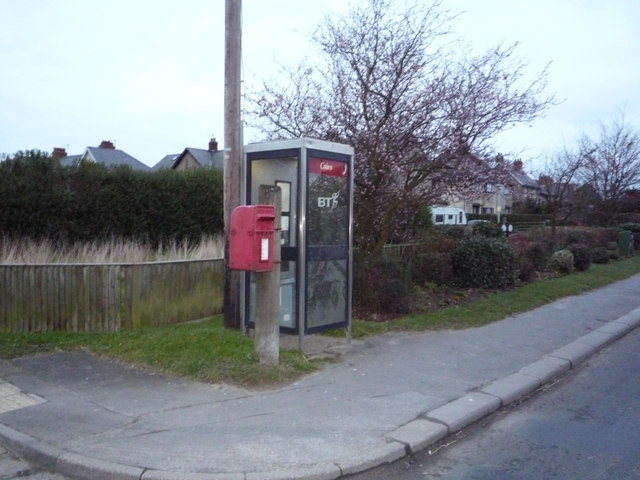 Elizabeth II postbox and telephone box on Main Street, Cayton
