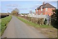 Cottage beside a road to Radbrook Manor