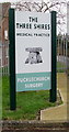 Nameboard outside The Three Shires Medical Practice Pucklechurch Surgery