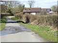 Farm buildings on Wimland Road with a boat