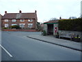 TA0479 : Bus stop and shelter on Main Street, Flixton by JThomas