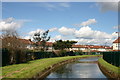 Backs of houses in Carnarvon Avenue, Enfield abutting New River