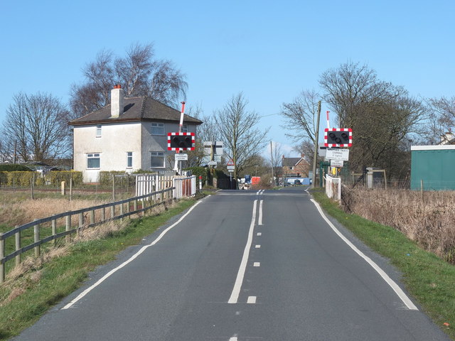 Approaching the Level Crossing on Wyke... © Gary Rogers cc-by-sa/2.0 ...