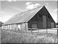 TF8607 : Unusual farm shed by Evelyn Simak