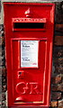 King George V postbox in a Bath Road brick wall, Stonehouse