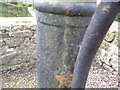 Wiston - old village pump in centre of road junction - detail